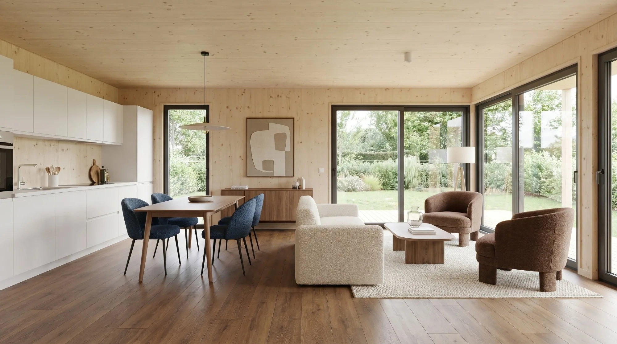 Séjour d'une maison Greenkub : coin repas, cuisine ouverte, parement bois épicéa et baies vitrées sur le jardin